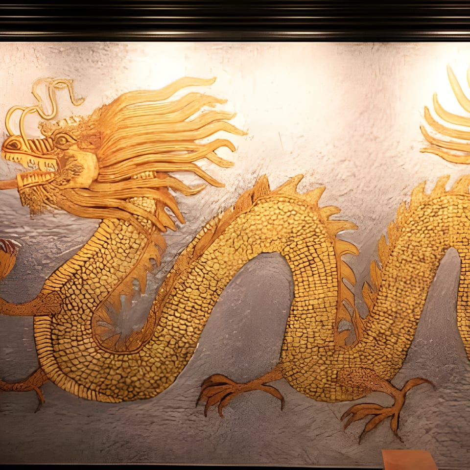 Golden dragon mural with intricate scales and flowing mane on a textured gray wall at Asiana Cafe.