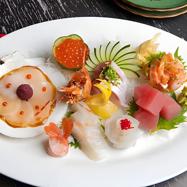 A vibrant platter of Asiana Cafe's Asian-fusion sashimi and seafood, including scallops, tuna, and shrimp.